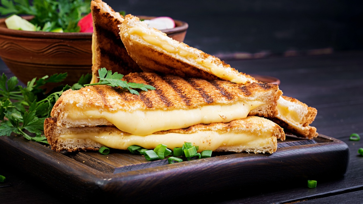 American hot cheese sandwich. Homemade grilled cheese sandwich for breakfast.